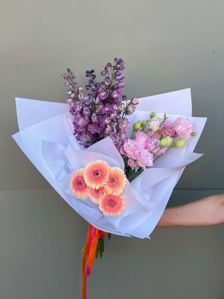 Pastel bouquet with peach Gerberas, Delphinium and soft pink Lisianthus