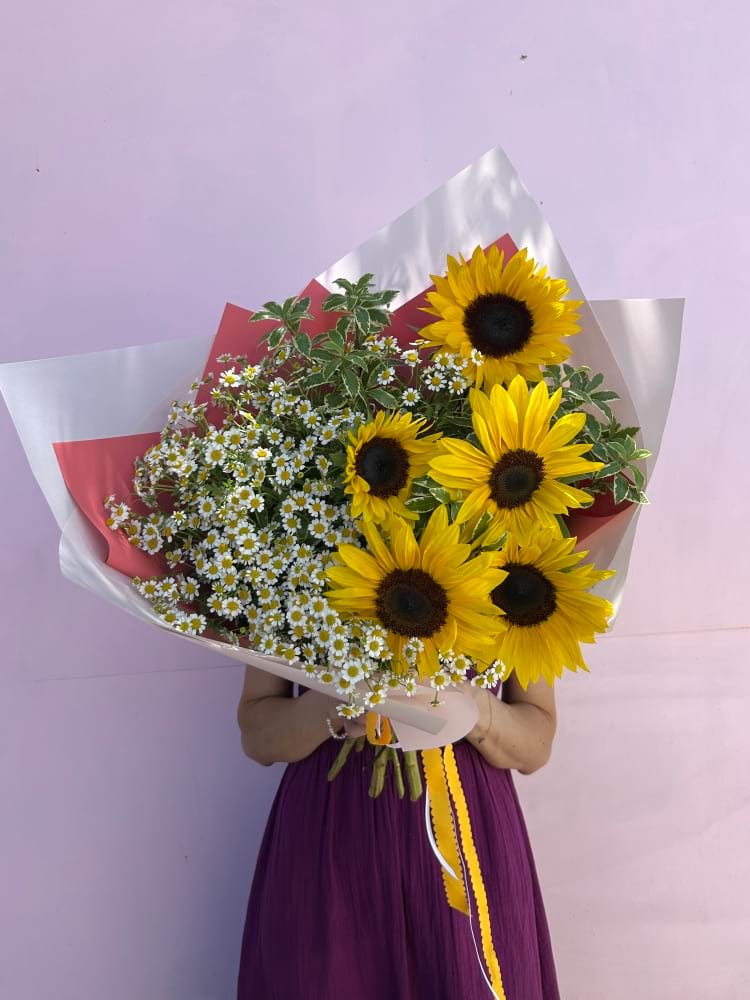 The perfect bouquet for your love- the person that loves to dance among the wild flowers!  Think fields of wild flowers, holidays, picnics and long walks in the sunshine- this is the perfect choice for that gorgeous, free spirit in your life!  Locally sourced blooms including Chamomile daisies and sunflowers this bouquet is precious!! Beautifully wrapped in our signature wrap and long flowing scalloped ribbons. 